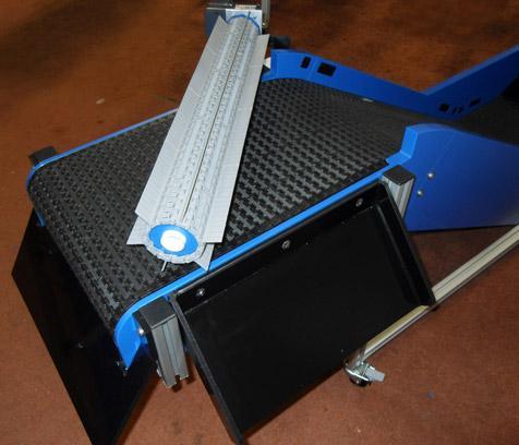 conveyor with paddle sprue separator